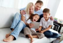 family playing quiz on tablet